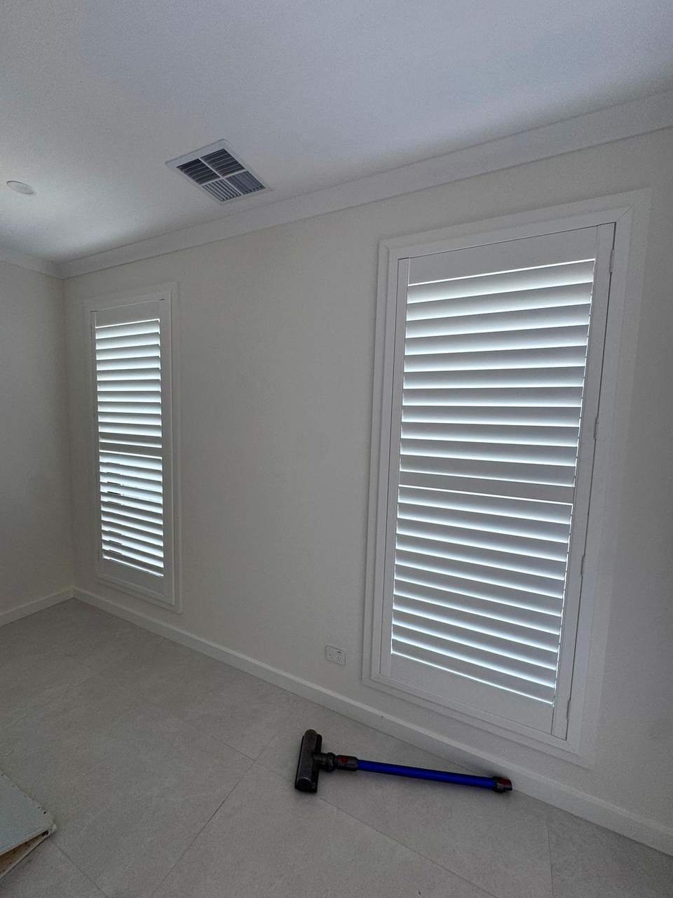 White plantation shutters with open louvres