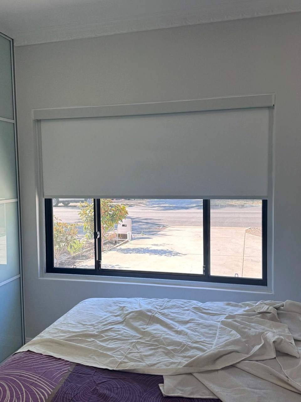 Blockout roller blind with headbox on a bedroom window