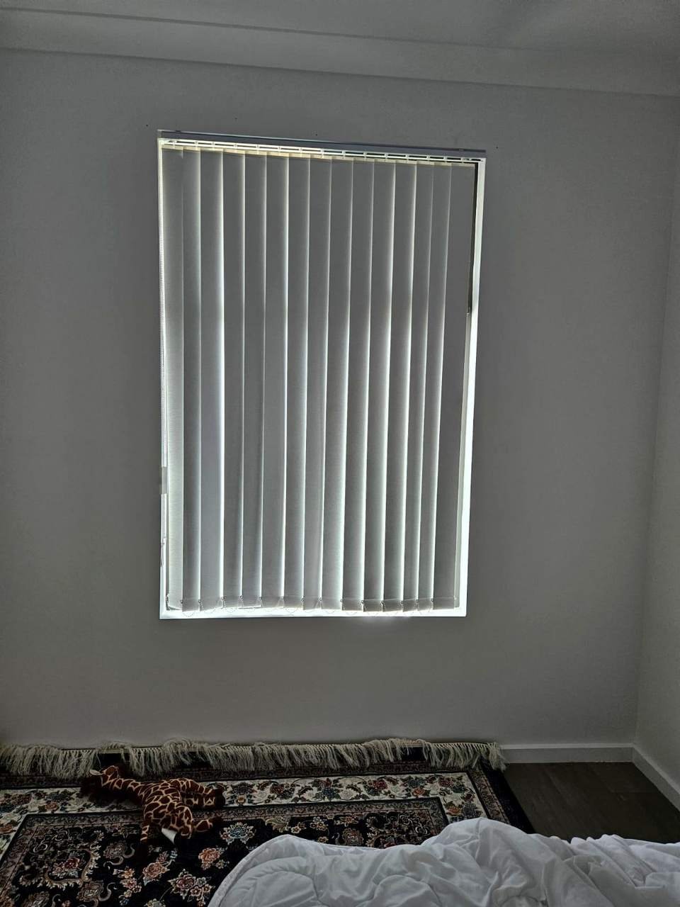 Vertical blinds on a bedroom window